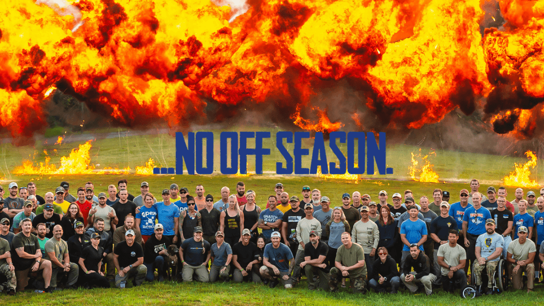 No Off Season Large group of The Tactical Games athletes posing in front of large explosions in the background